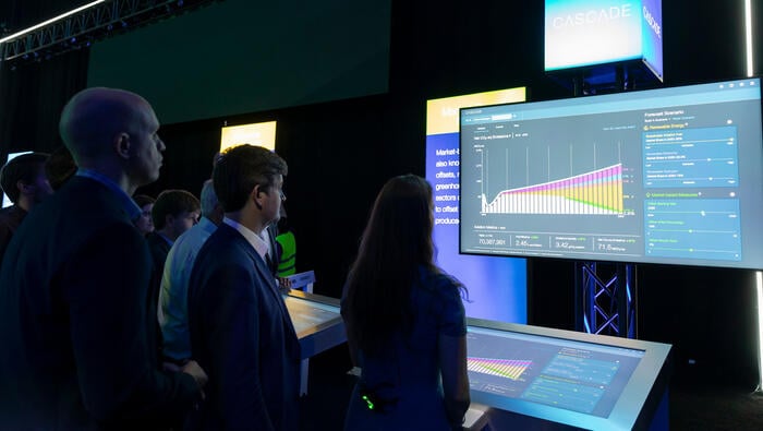 People observe a demonstration of Boeing's Cascade tool